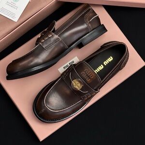 Miu Miu Dark Brown Leather Penny Loafers with Gold Crest